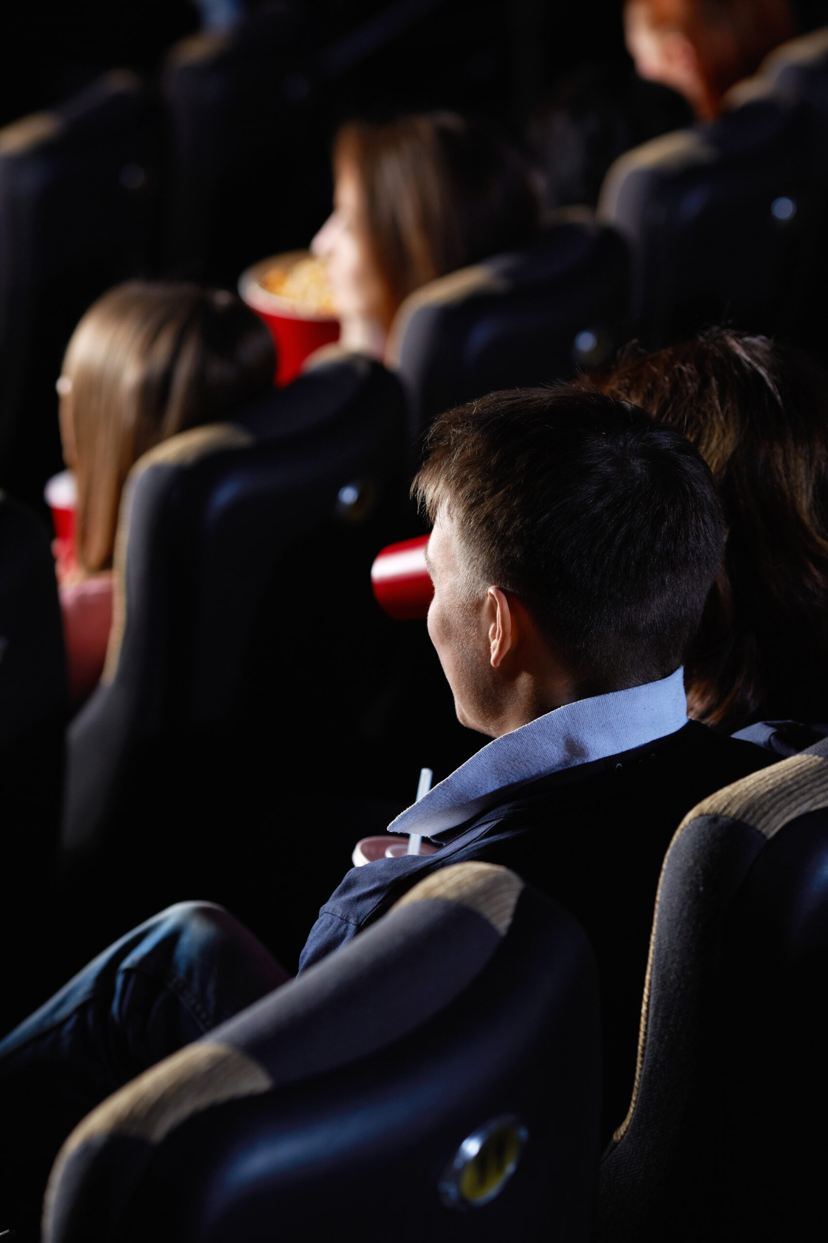 Audience watching film in cinema